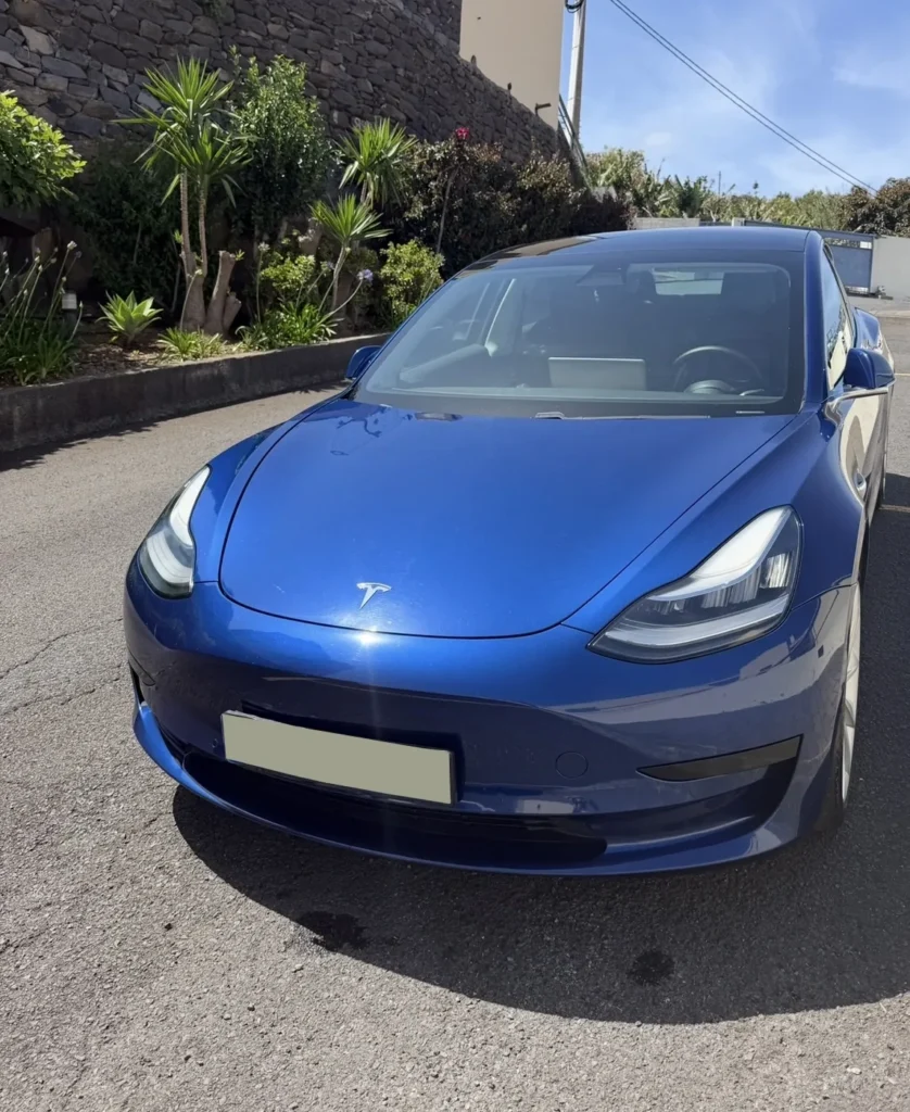 Tesla Model 3 rental car in Madeira, front three quarter view