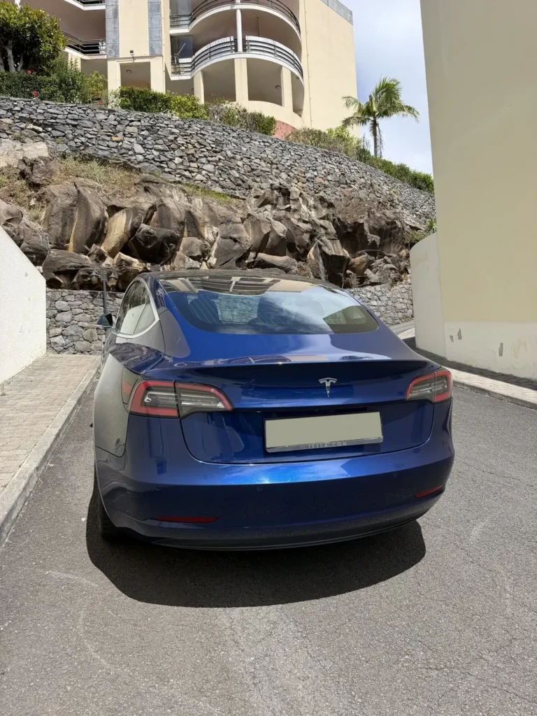 Rear view of the Tesla Model 3 rental car in Madeira